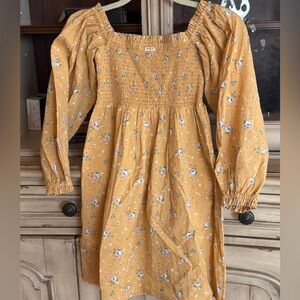 Childrens Wrangler tunic or dress. The print is a variety of delicate flowers.